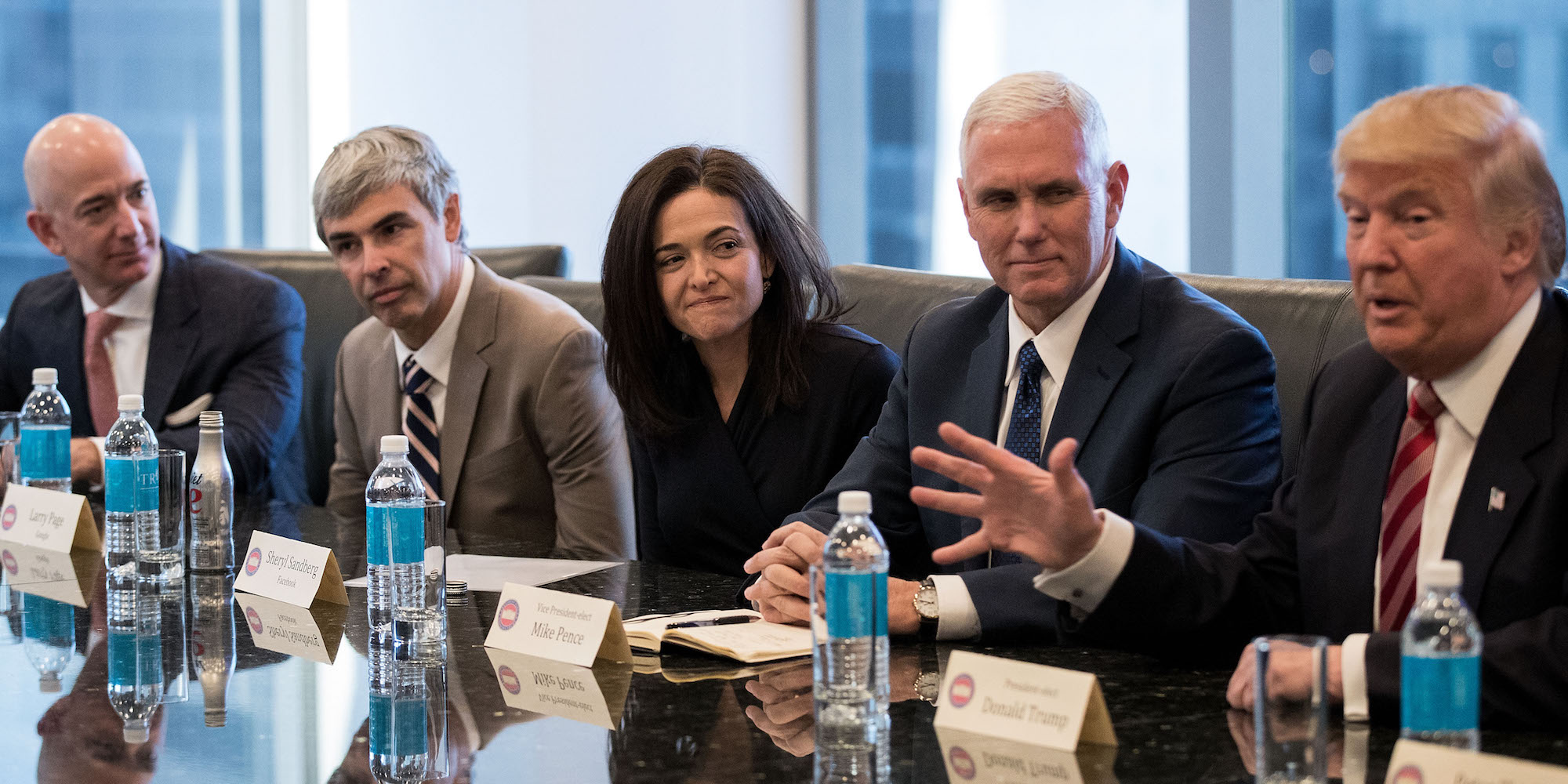 NEW YORK, NY - DECEMBER 14: (L to R) Jeff Bezos, chief executive officer of Amazon, Larry Page, chief executive officer of Alphabet Inc. (parent company of Google), Sheryl Sandberg, chief operating officer of Facebook, Vice President-elect Mike Pence listen as President-elect Donald Trump speaks during a meeting of technology executives at Trump Tower, December 14, 2016 in New York City. This is the first major meeting between President-elect Trump and technology industry leaders. (Photo by Drew Angerer/Getty Images)