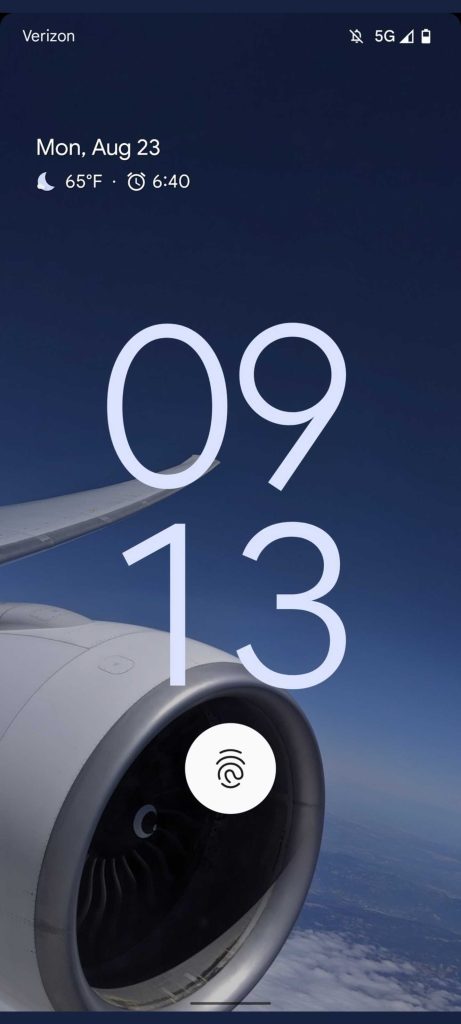 Screenshot of what might be the Pixel 6 Pro's lock screen, using an airplane's engine as its background
